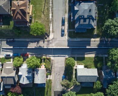 aerial view of green trees and white houses during daytime